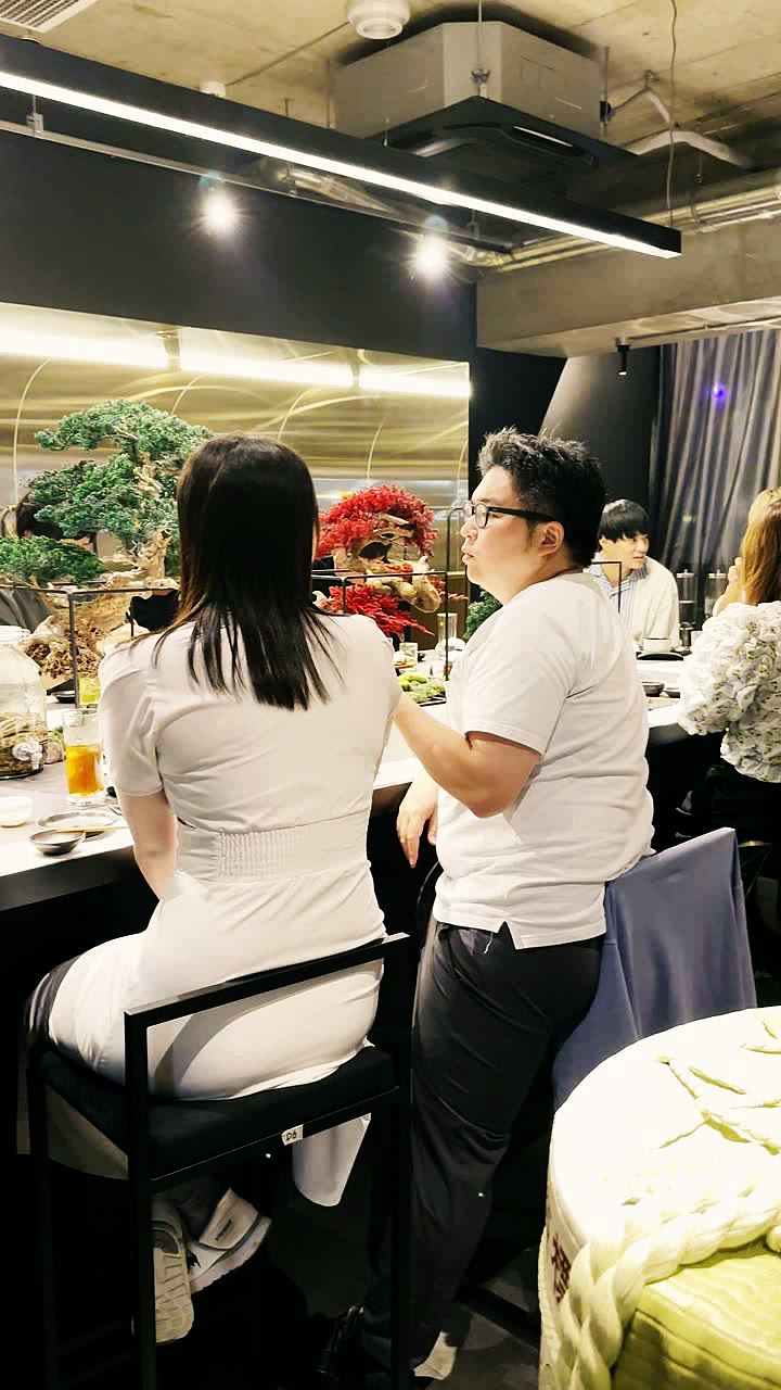 Guests standing around the counter during the show
